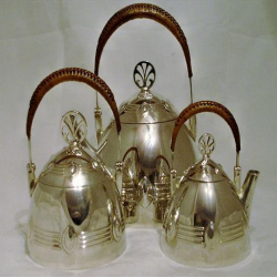 Antique WMF silver plated biscuit jar with engraved crystal glass and Peacock handles. Circa 1905